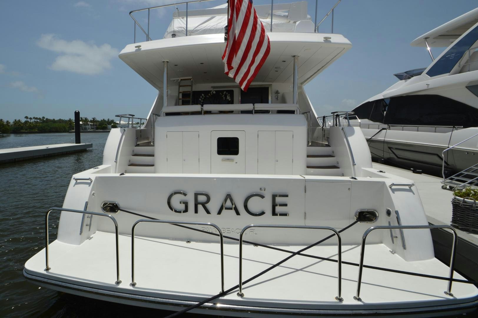 a boat with a flag on the front aboard GRACE Yacht for Sale