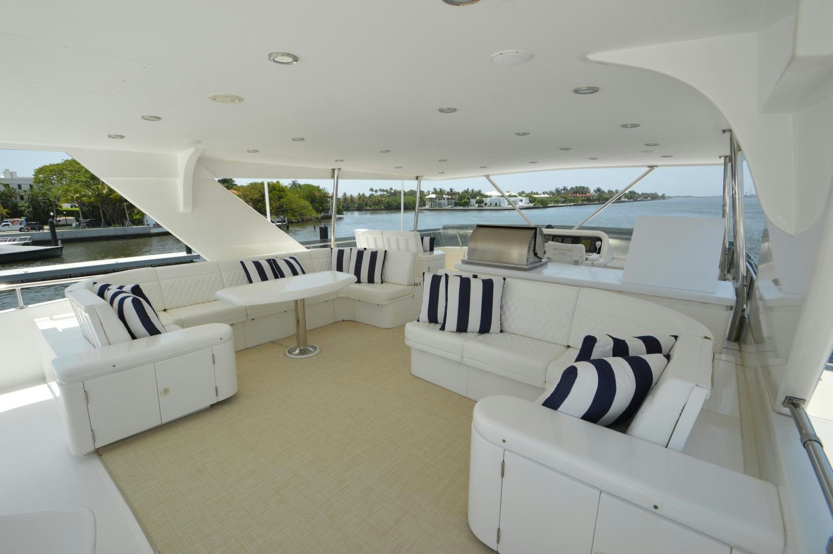 a room with white couches aboard GRACE Yacht for Sale