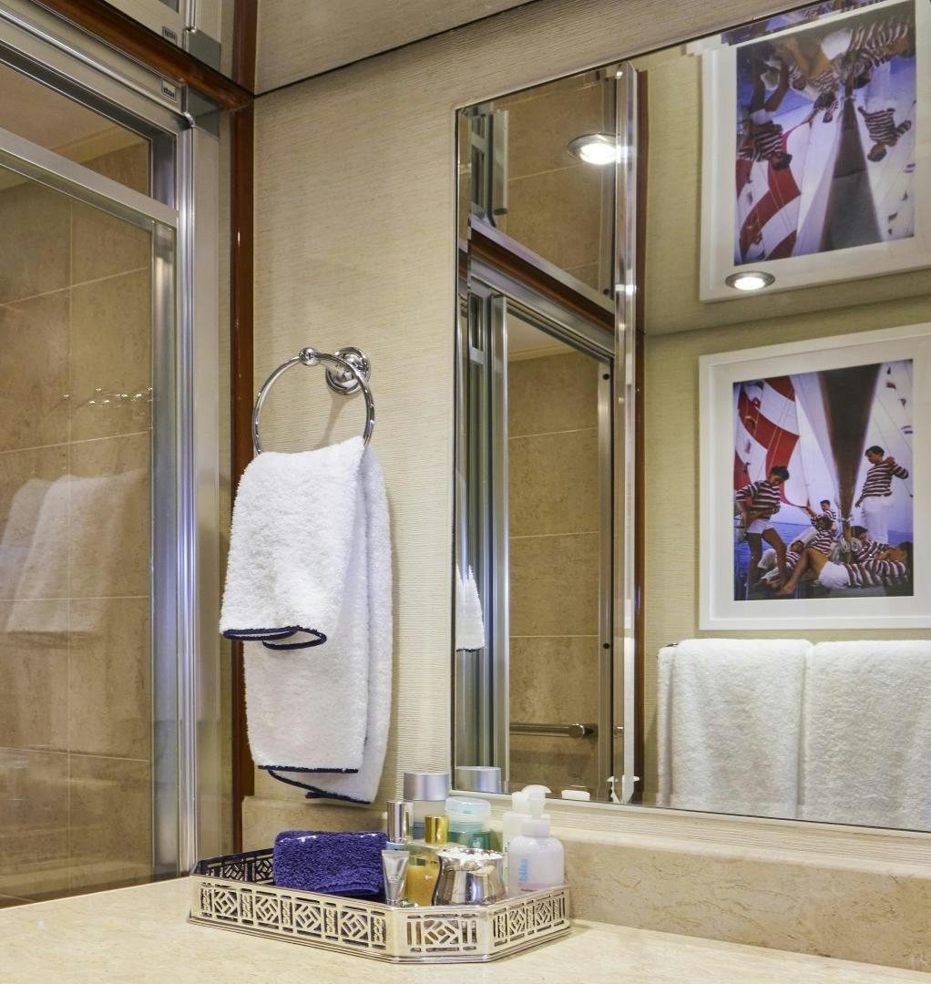 a bathroom with a large mirror aboard GRACE Yacht for Sale