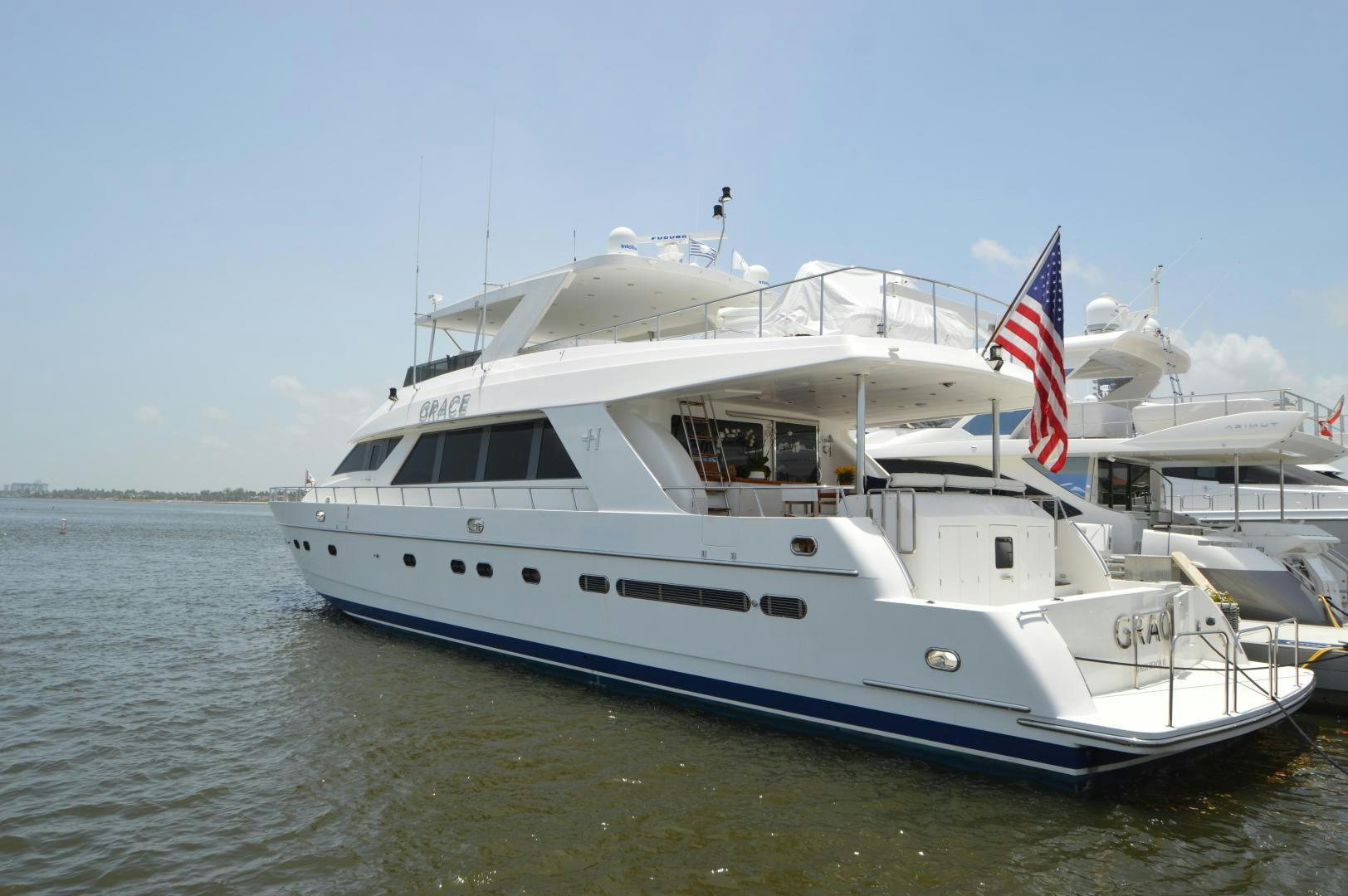 a large white boat in the water aboard GRACE Yacht for Sale