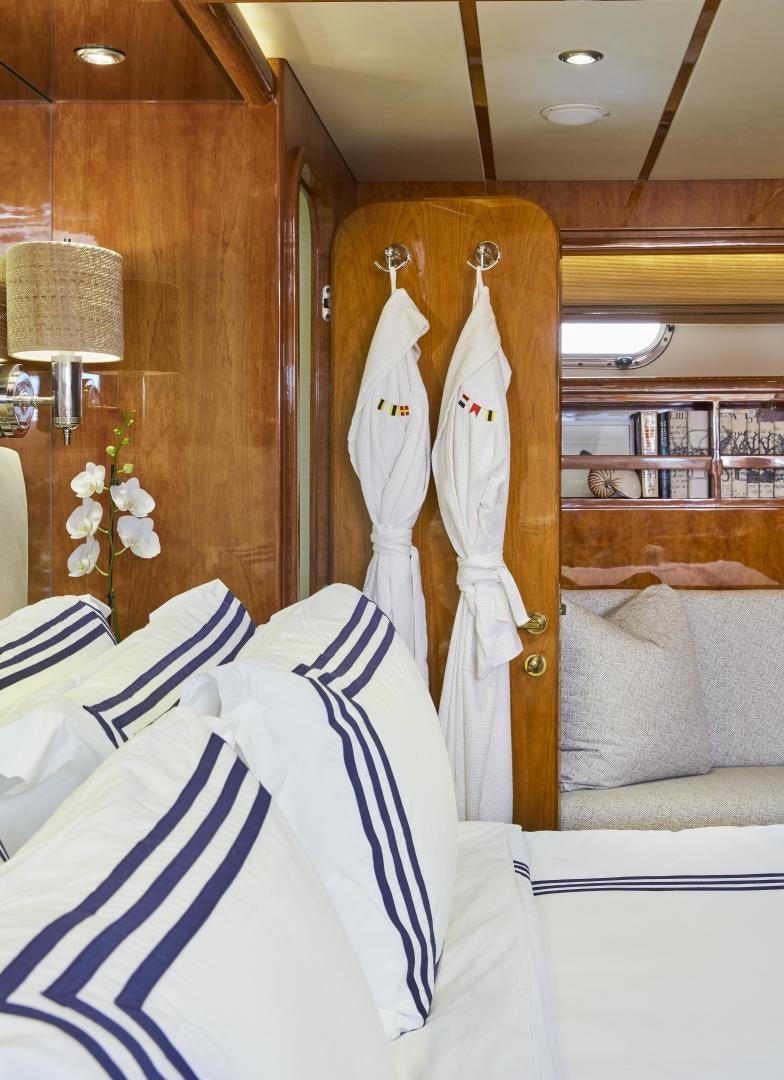 a room with a robe on the wall aboard GRACE Yacht for Sale