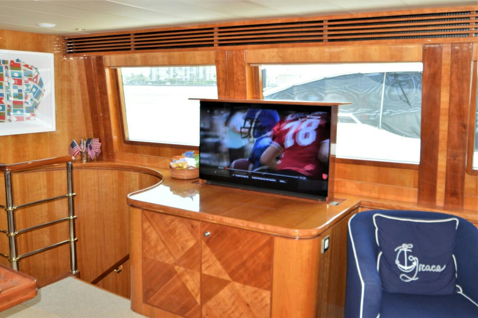 a tv on a table aboard GRACE Yacht for Sale