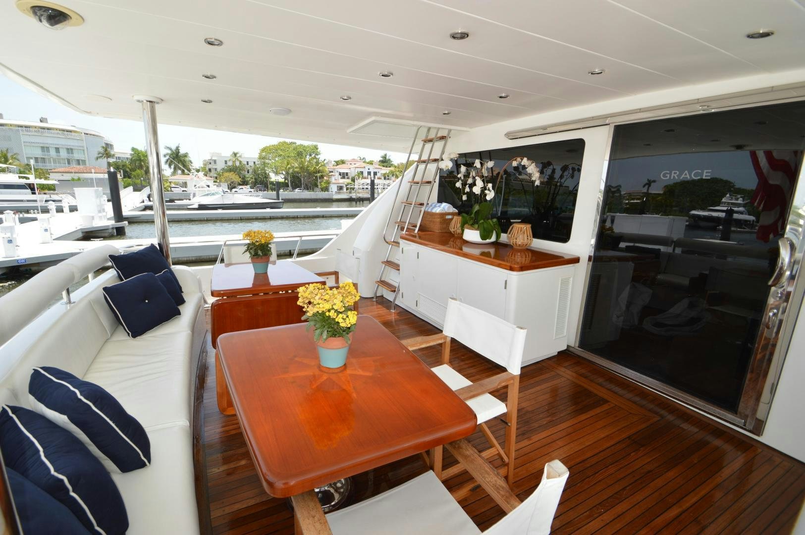 a room with a table and chairs aboard GRACE Yacht for Sale