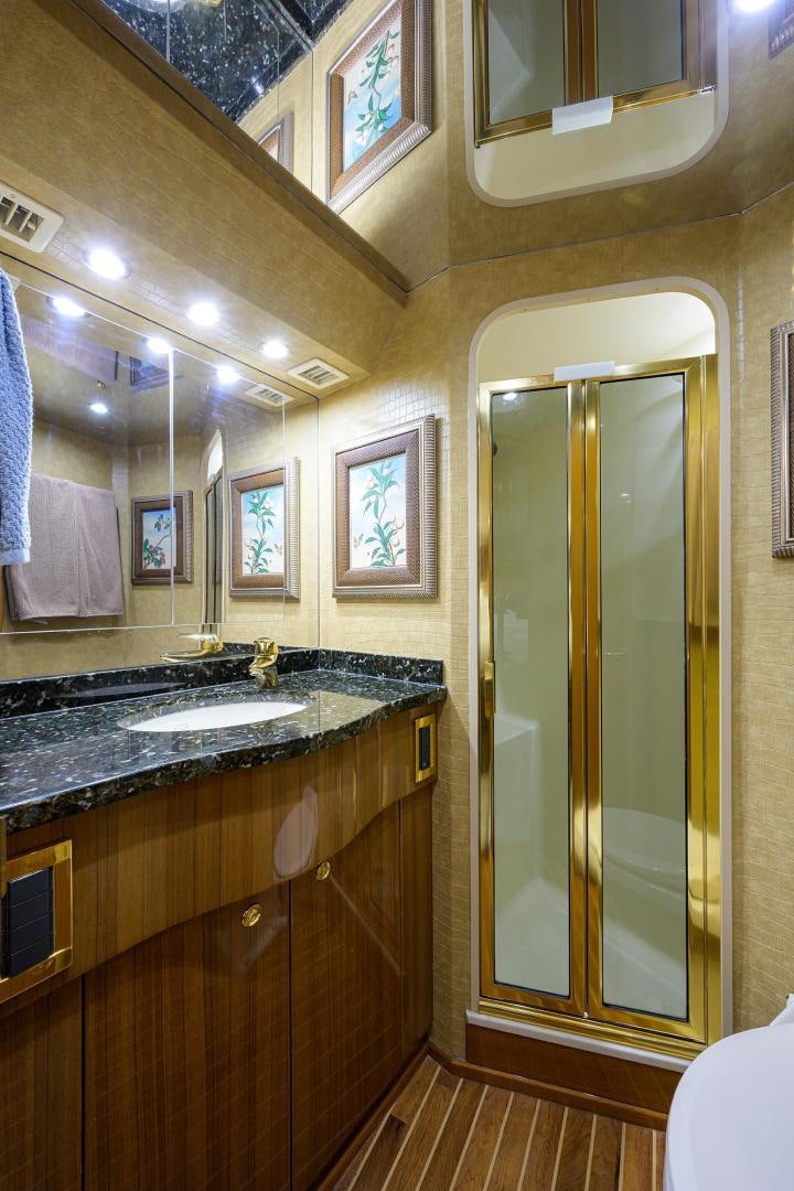 a bathroom with a glass shower aboard LA LADY Yacht for Sale