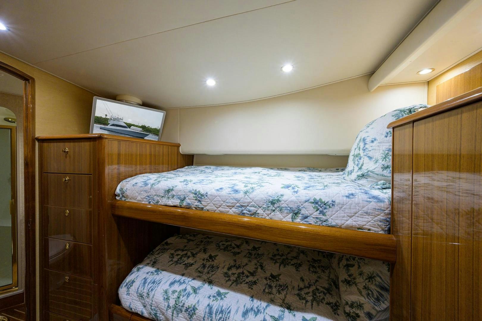 a bedroom with two beds aboard LA LADY Yacht for Sale