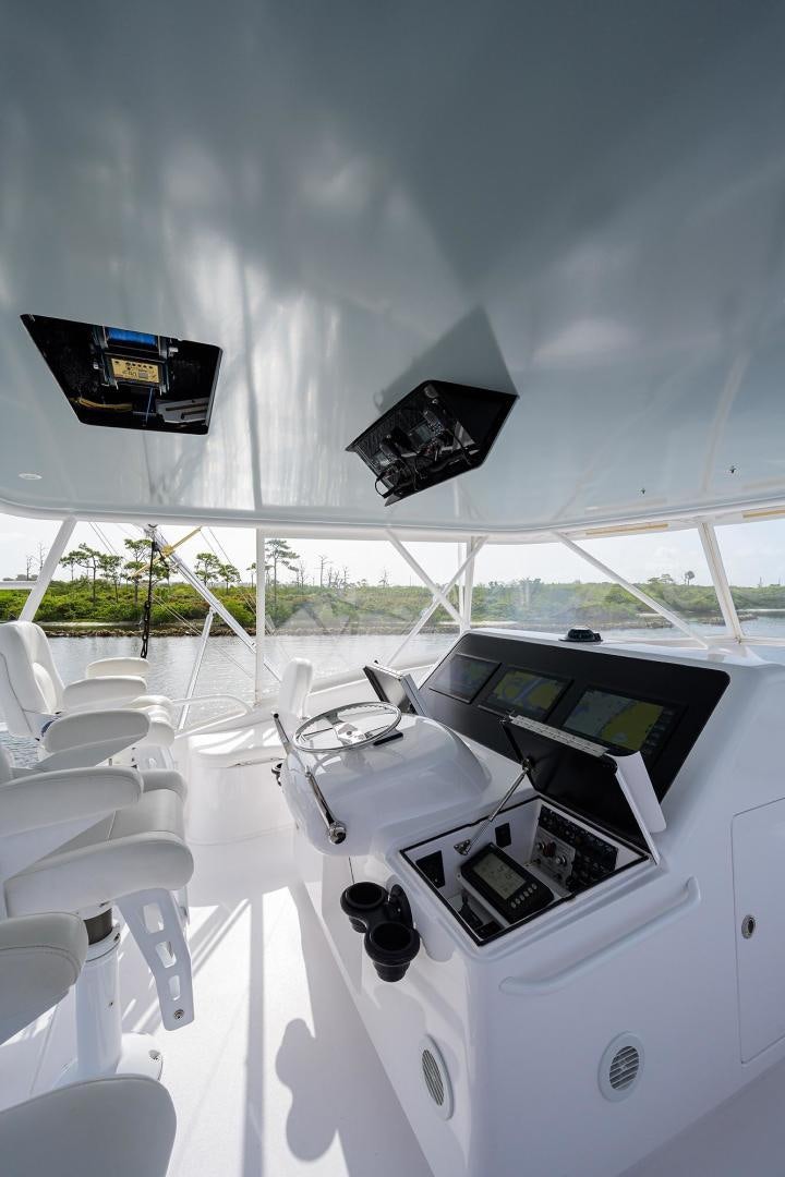 a white car with a black screen aboard LA LADY Yacht for Sale