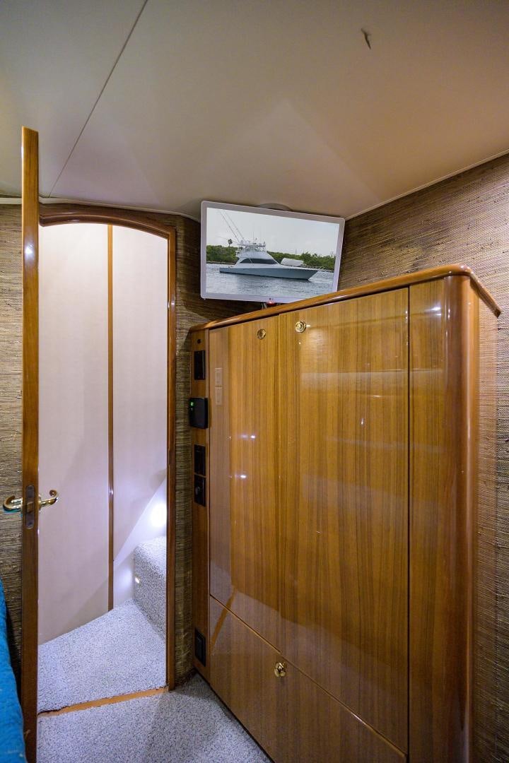 a wooden cabinet in a room aboard LA LADY Yacht for Sale