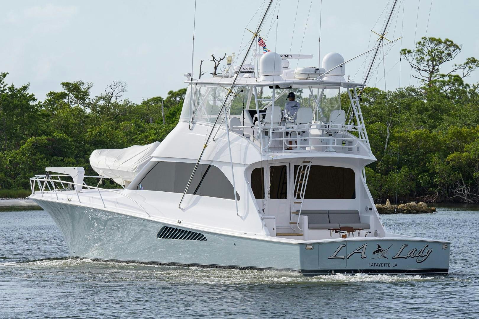 a white boat on the water aboard LA LADY Yacht for Sale
