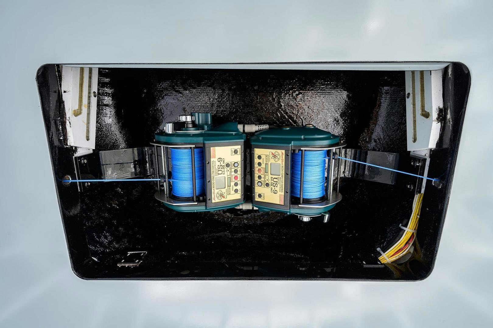 a black rectangular object with blue and yellow containers aboard LA LADY Yacht for Sale