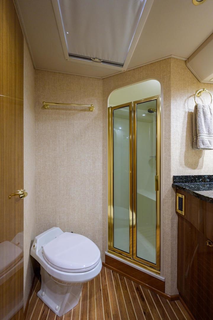 a bathroom with a glass door aboard LA LADY Yacht for Sale