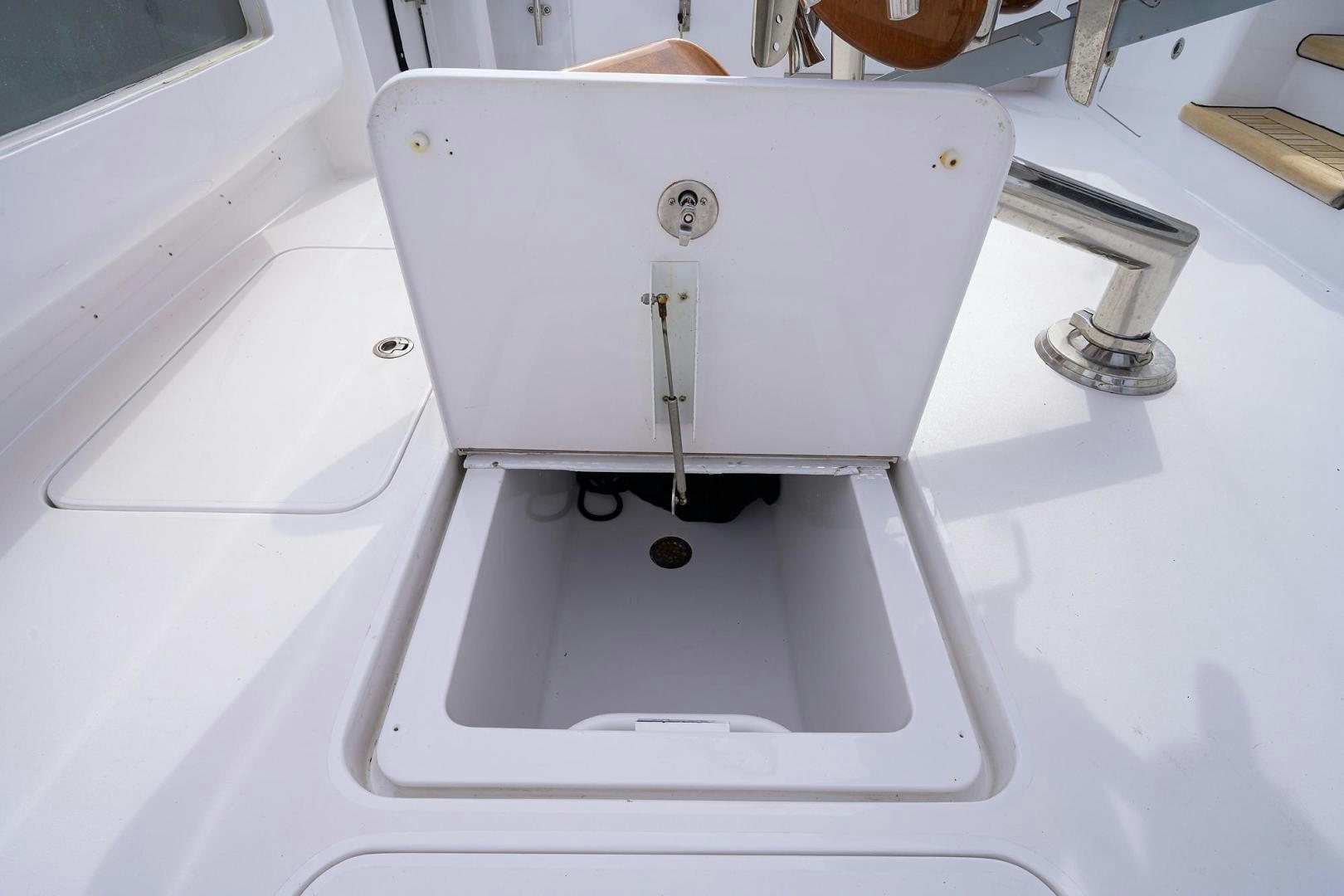 a white machine with a metal handle aboard LA LADY Yacht for Sale