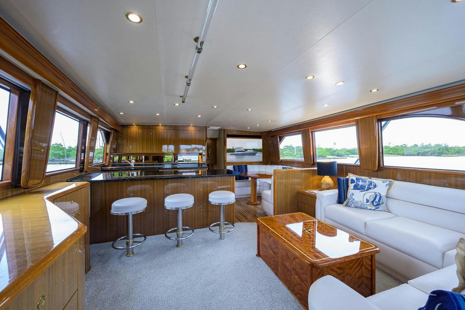 a large living room with a large window aboard LA LADY Yacht for Sale