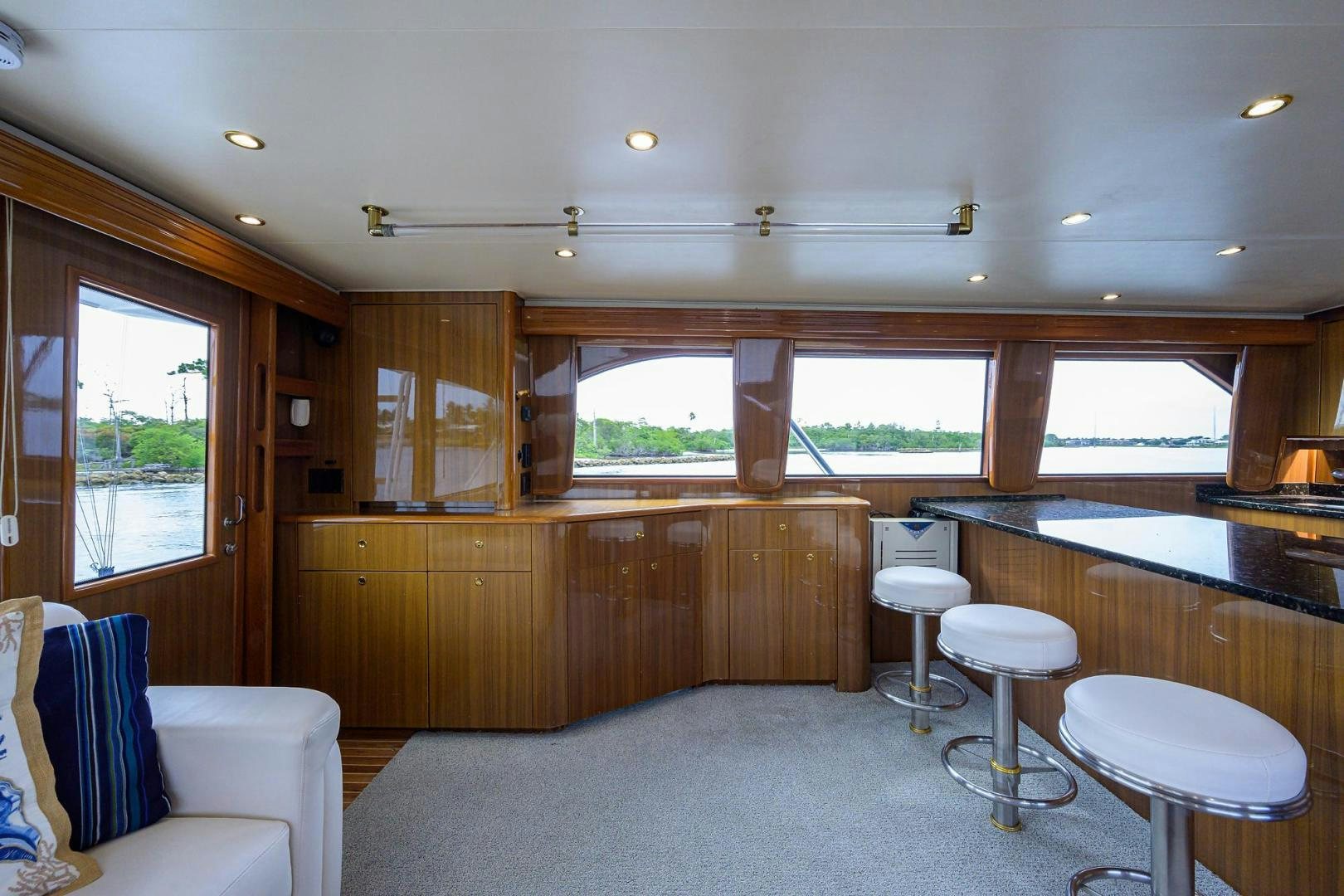 a room with a table chairs and a window aboard LA LADY Yacht for Sale