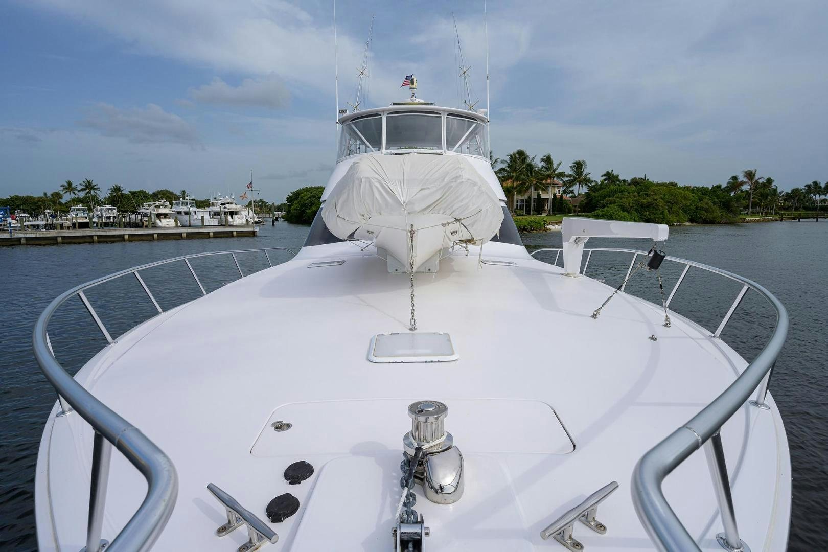 a white boat with a white sail aboard LA LADY Yacht for Sale