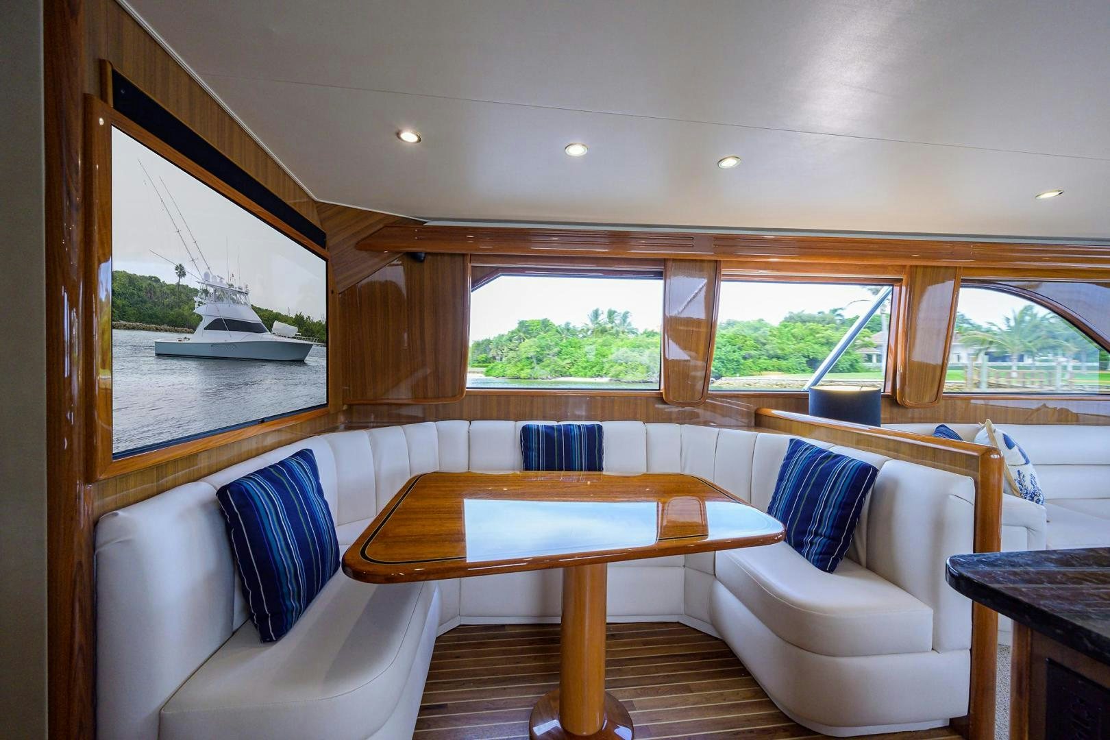 a room with a table and chairs aboard LA LADY Yacht for Sale