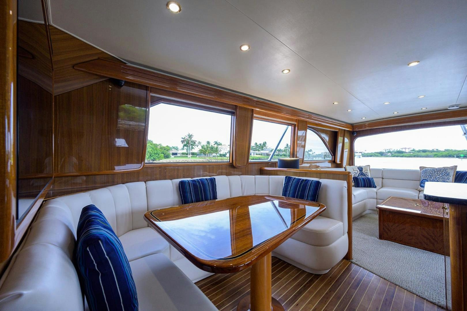 a living room with a couch and a table aboard LA LADY Yacht for Sale
