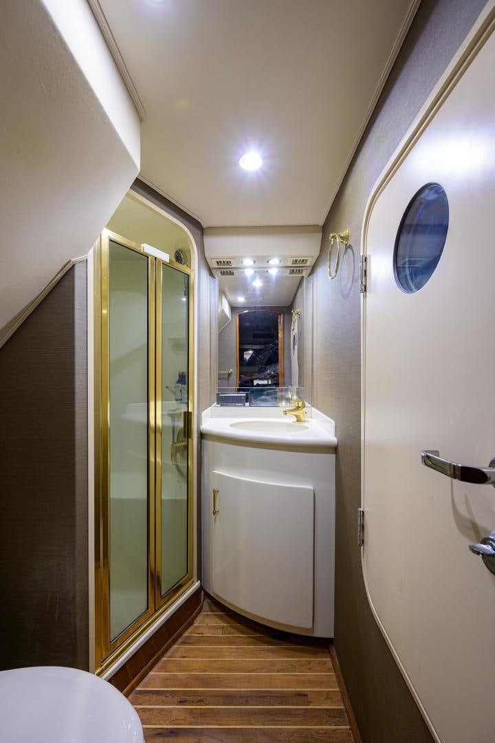 a bathroom with a large mirror aboard LA LADY Yacht for Sale
