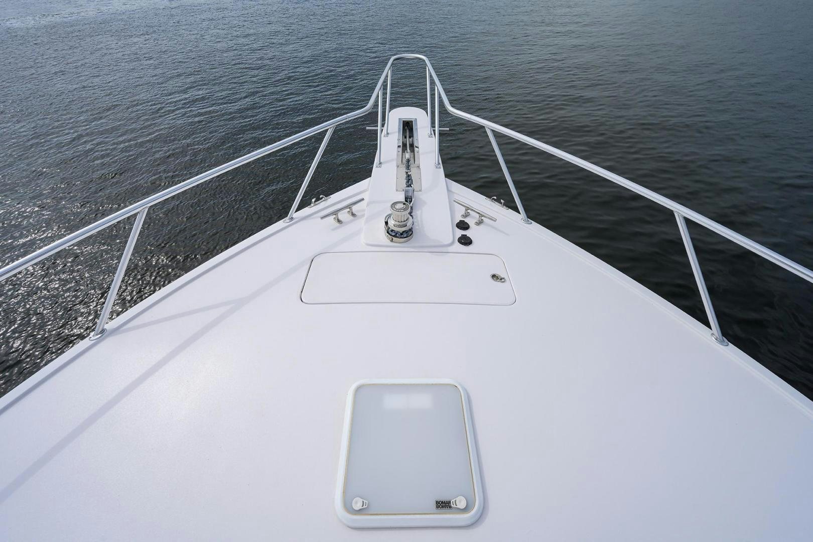 a white boat on a body of water aboard LA LADY Yacht for Sale