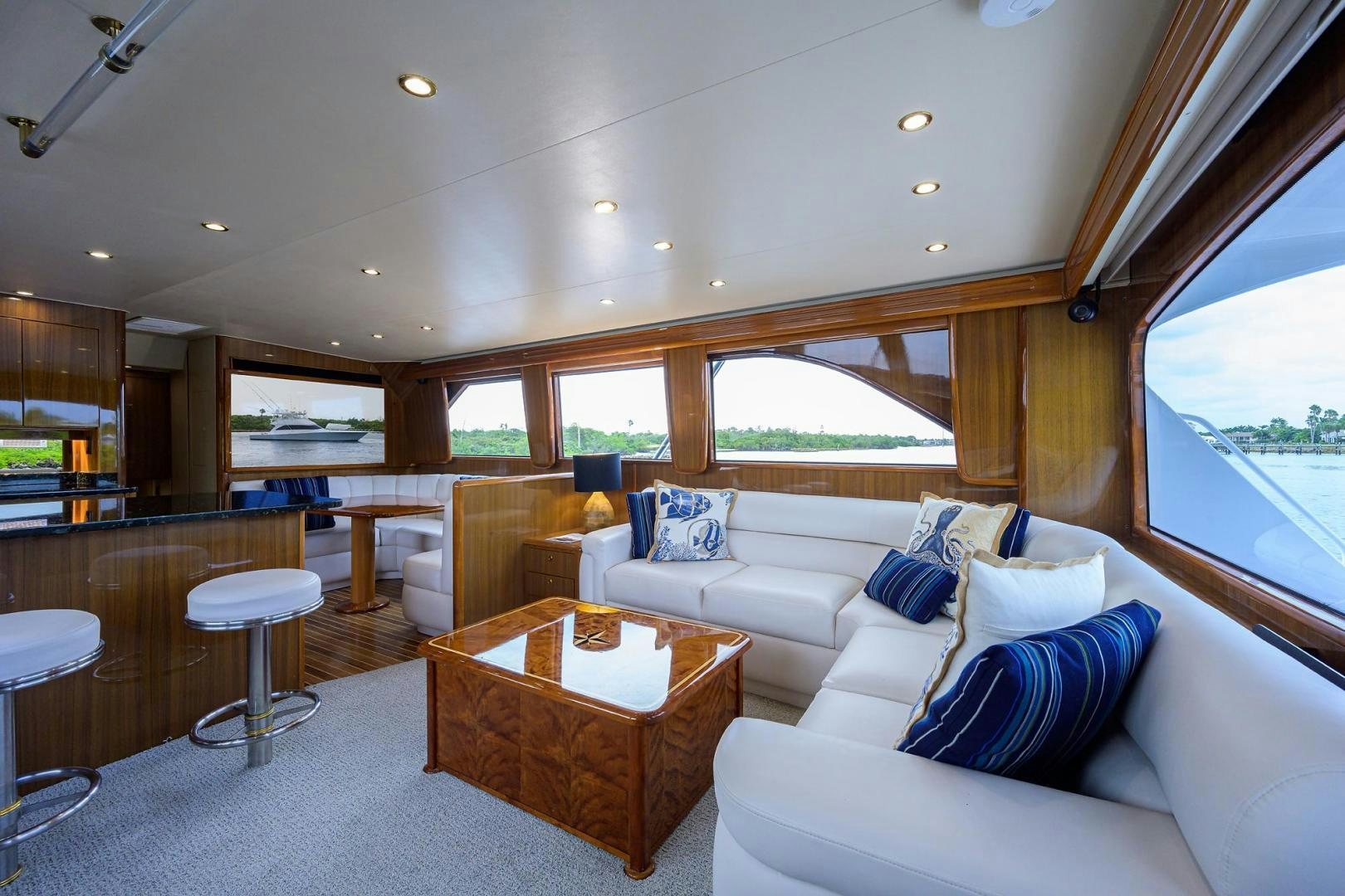 a living room with a couch and a table aboard LA LADY Yacht for Sale