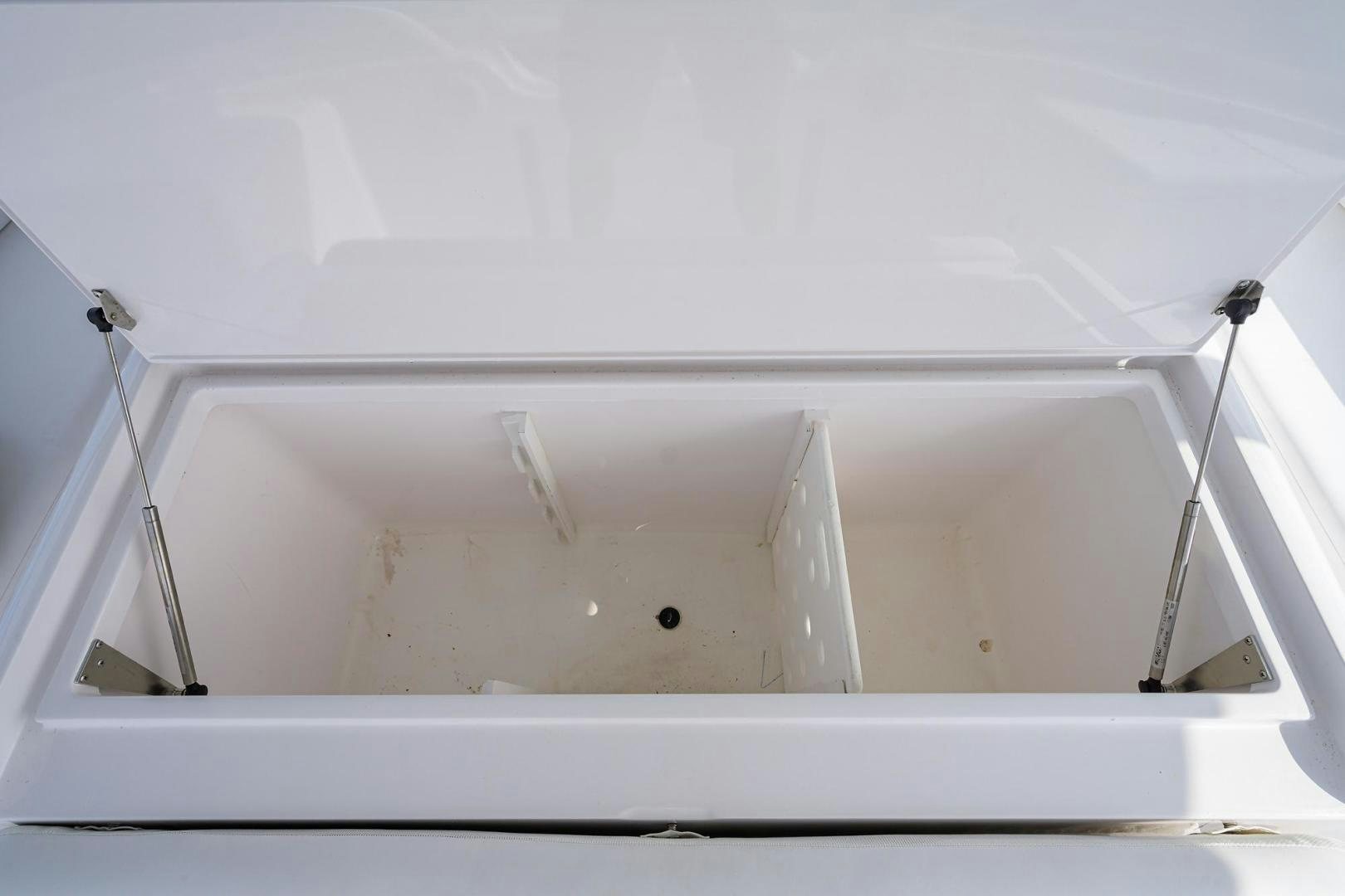 a white bathtub with a shower head aboard LA LADY Yacht for Sale