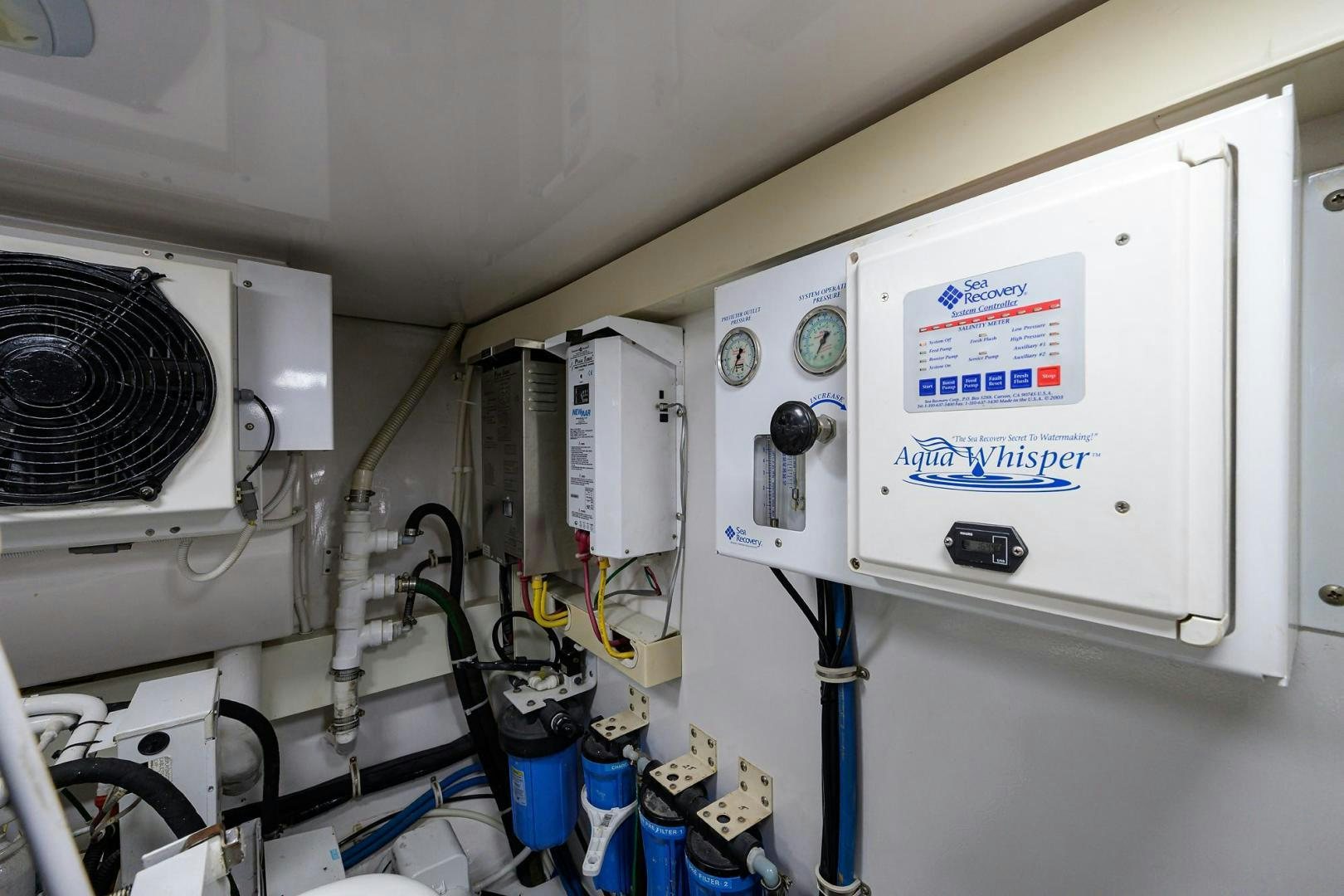 a white machine with a sign on it aboard LA LADY Yacht for Sale