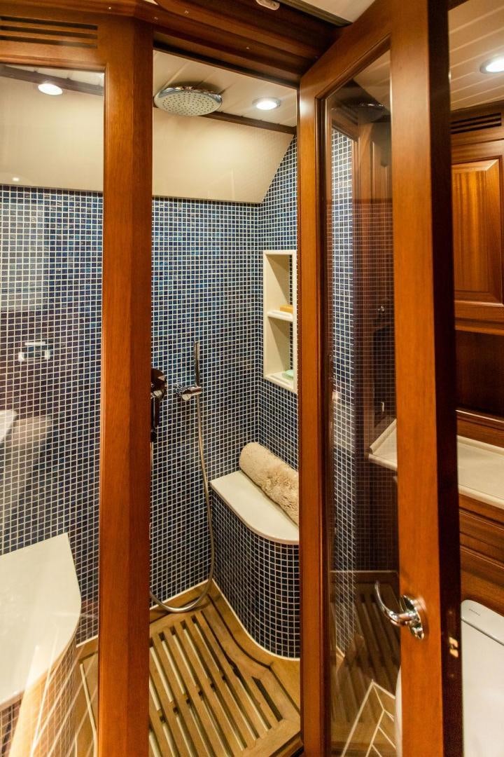 a bathroom with a glass shower aboard JESSICA Yacht for Sale