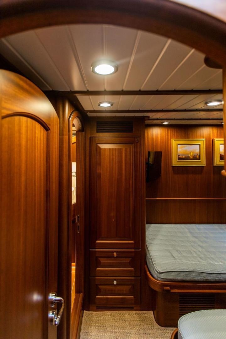 a room with a bed and a door aboard JESSICA Yacht for Sale