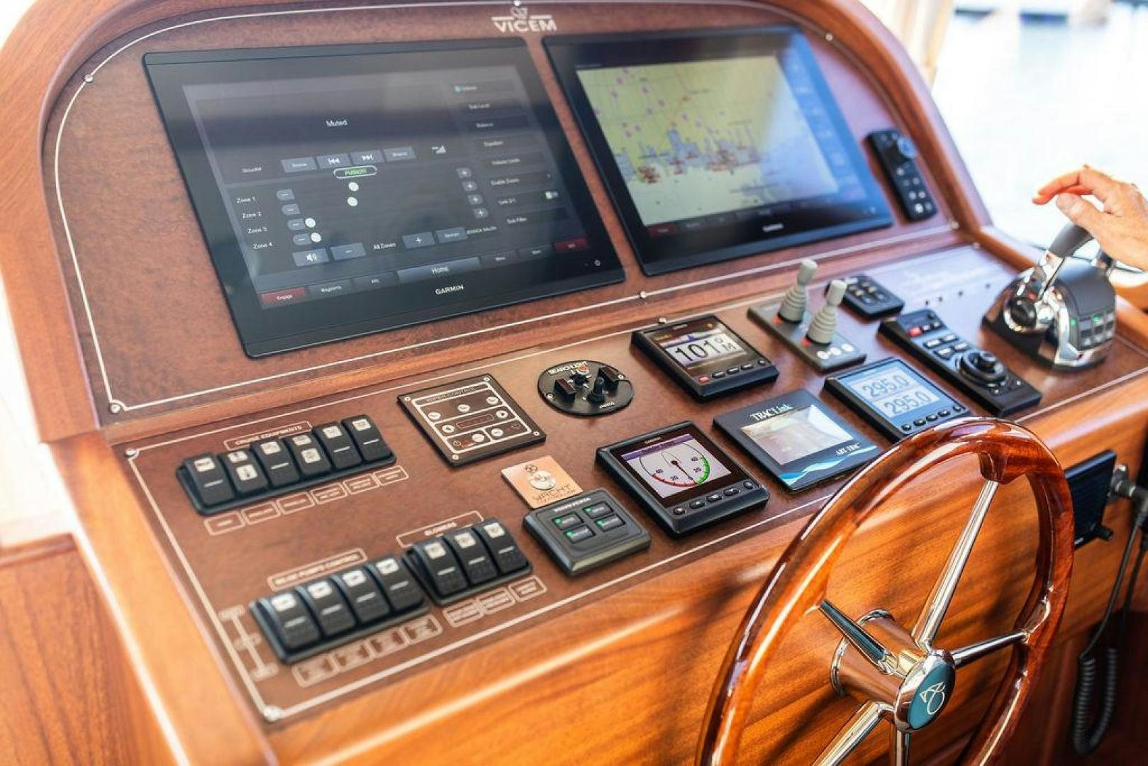 a desk with a computer and other electronics on it aboard JESSICA Yacht for Sale