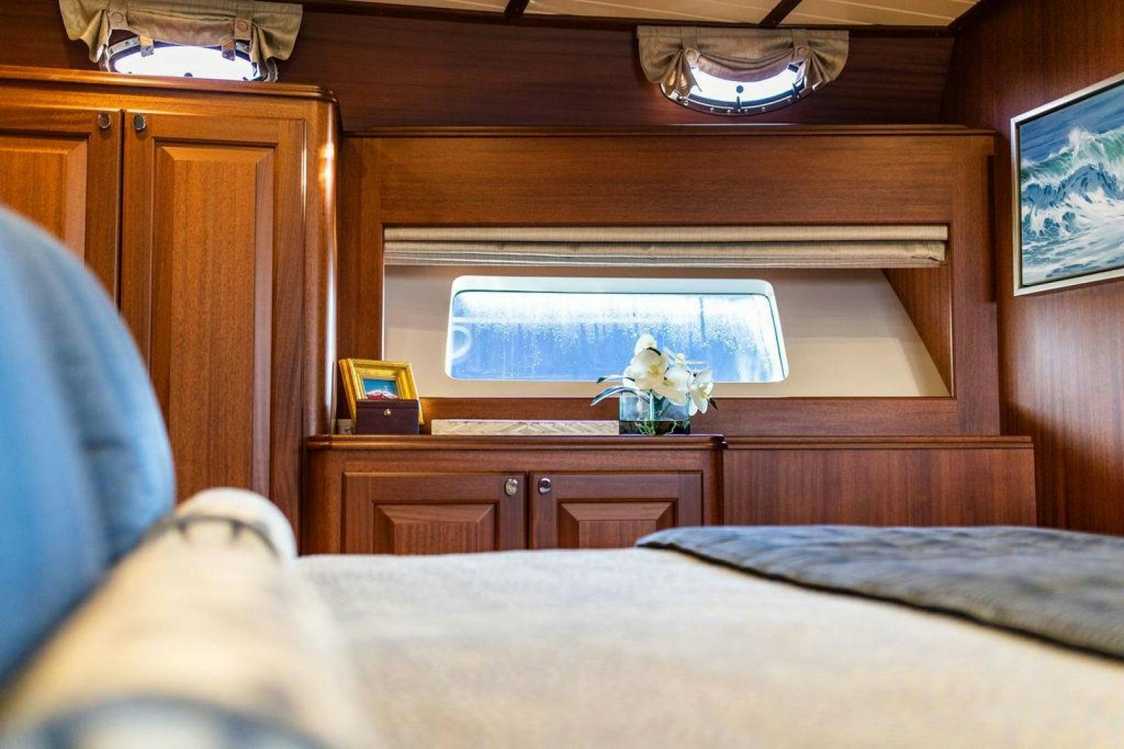 a room with a television and a bed aboard JESSICA Yacht for Sale