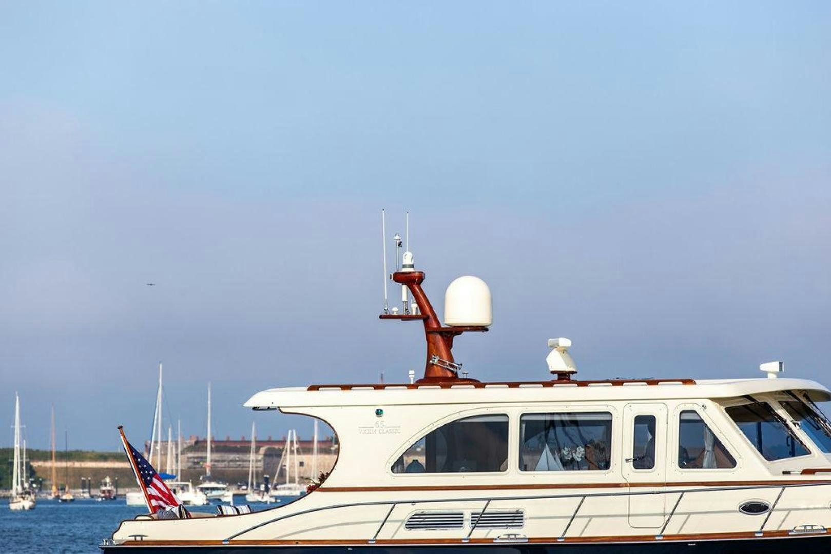 a boat with a flag on the front aboard JESSICA Yacht for Sale