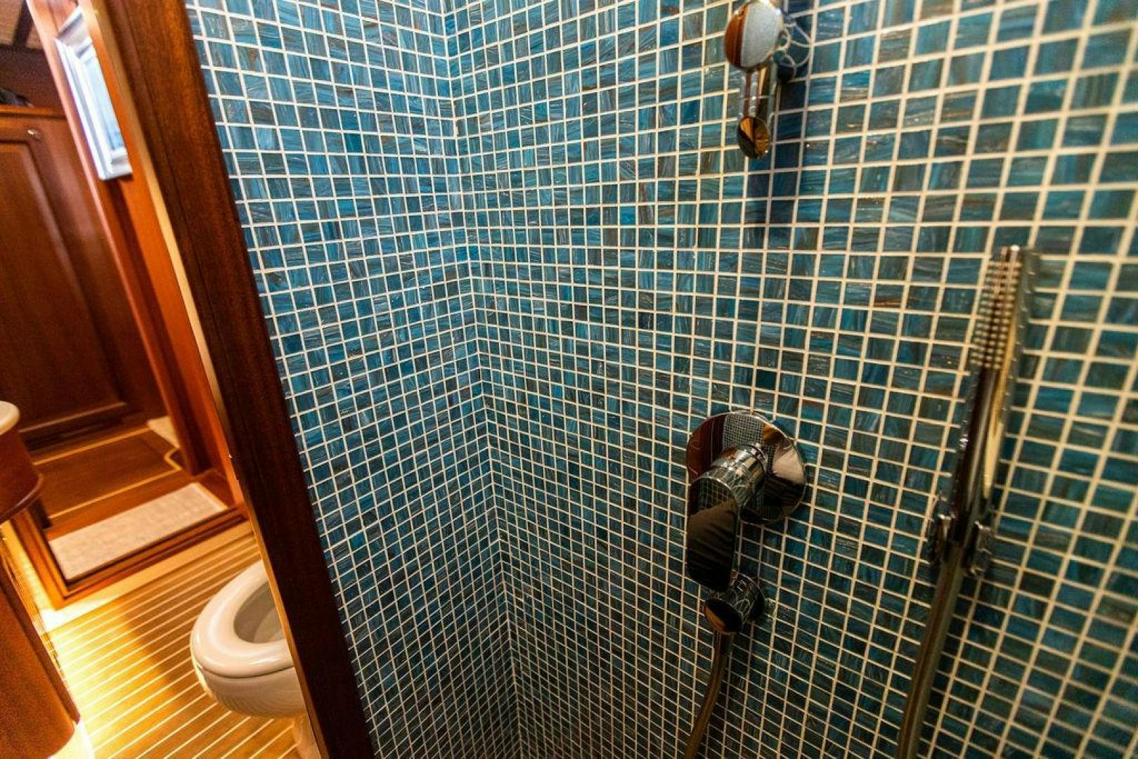 a person standing in a shower aboard JESSICA Yacht for Sale