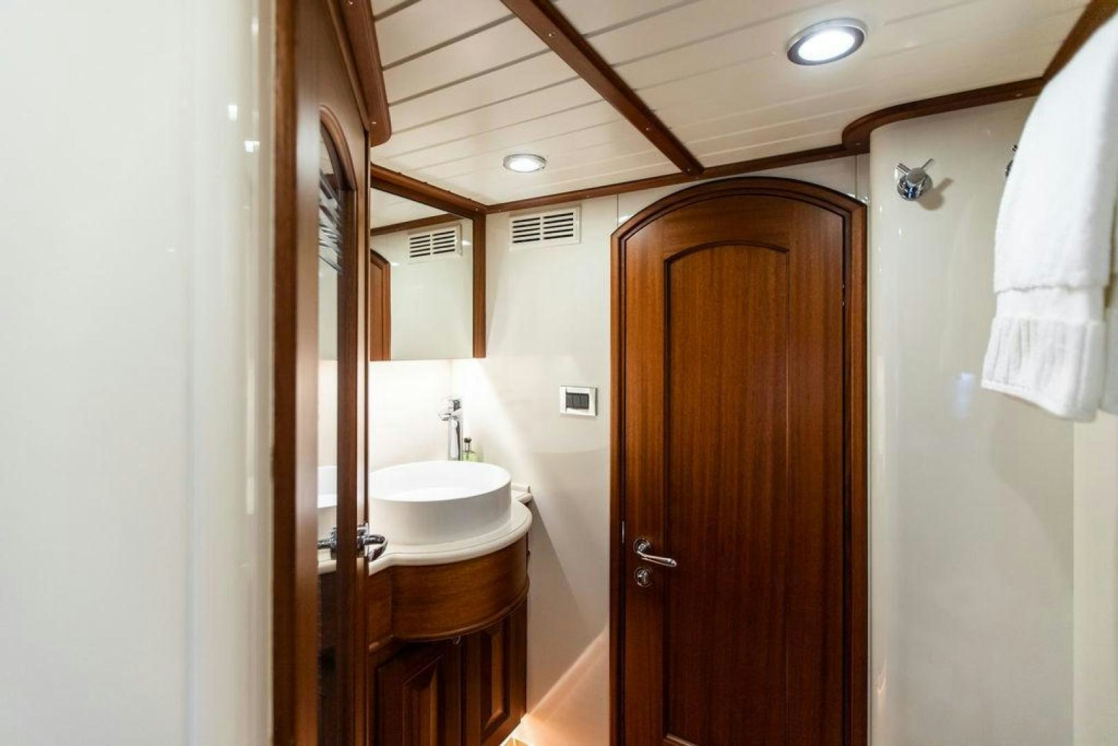 a bathroom with a sink and a mirror aboard JESSICA Yacht for Sale