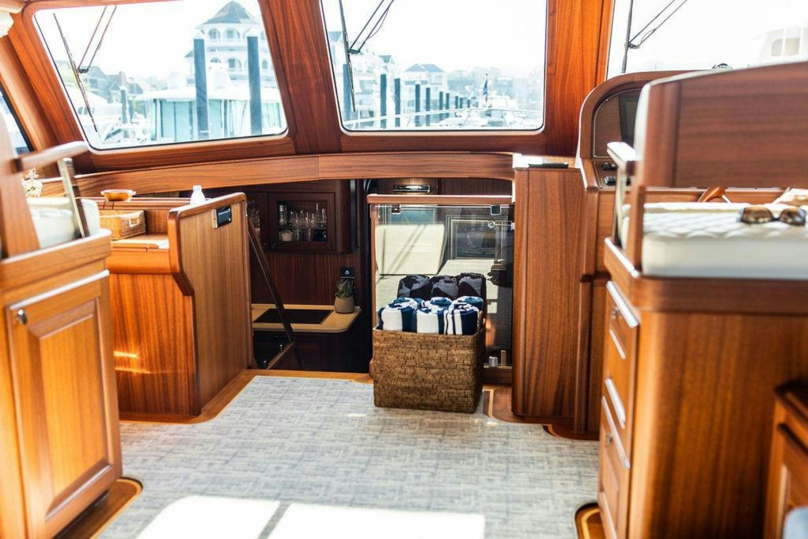 a room with a basket and a table and chairs aboard JESSICA Yacht for Sale