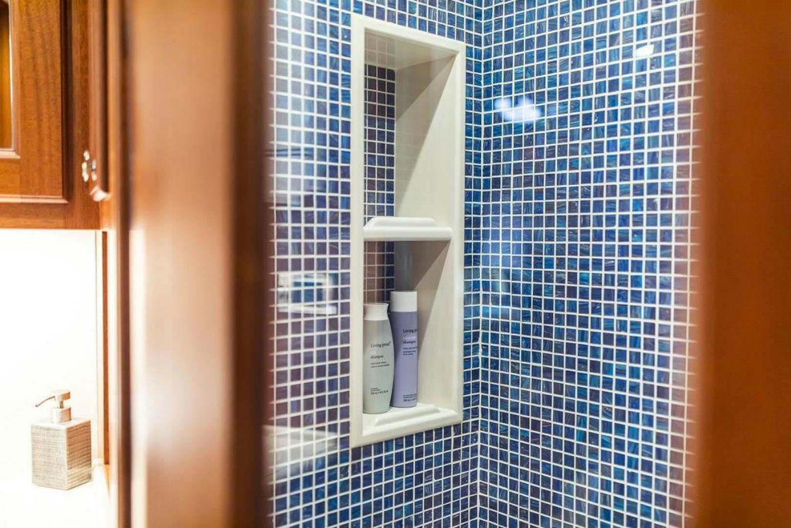 a glass bottle on a tile floor aboard JESSICA Yacht for Sale