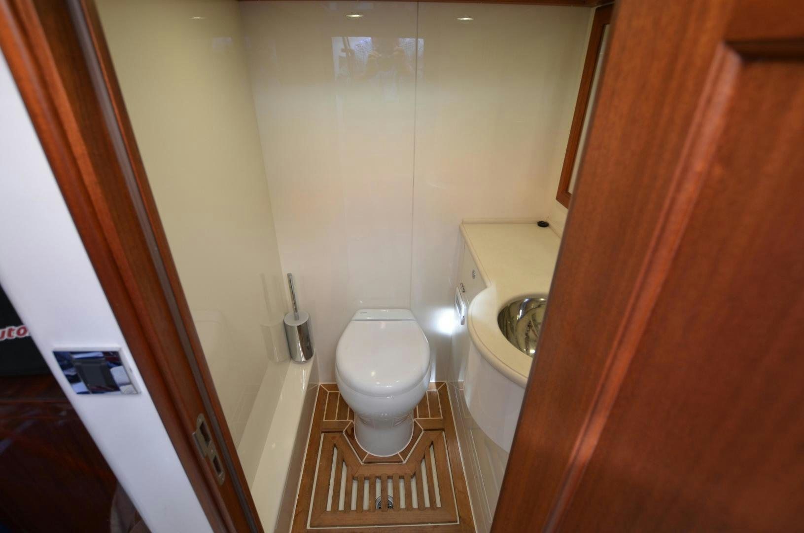 a bathroom with a toilet and sink aboard JESSICA Yacht for Sale