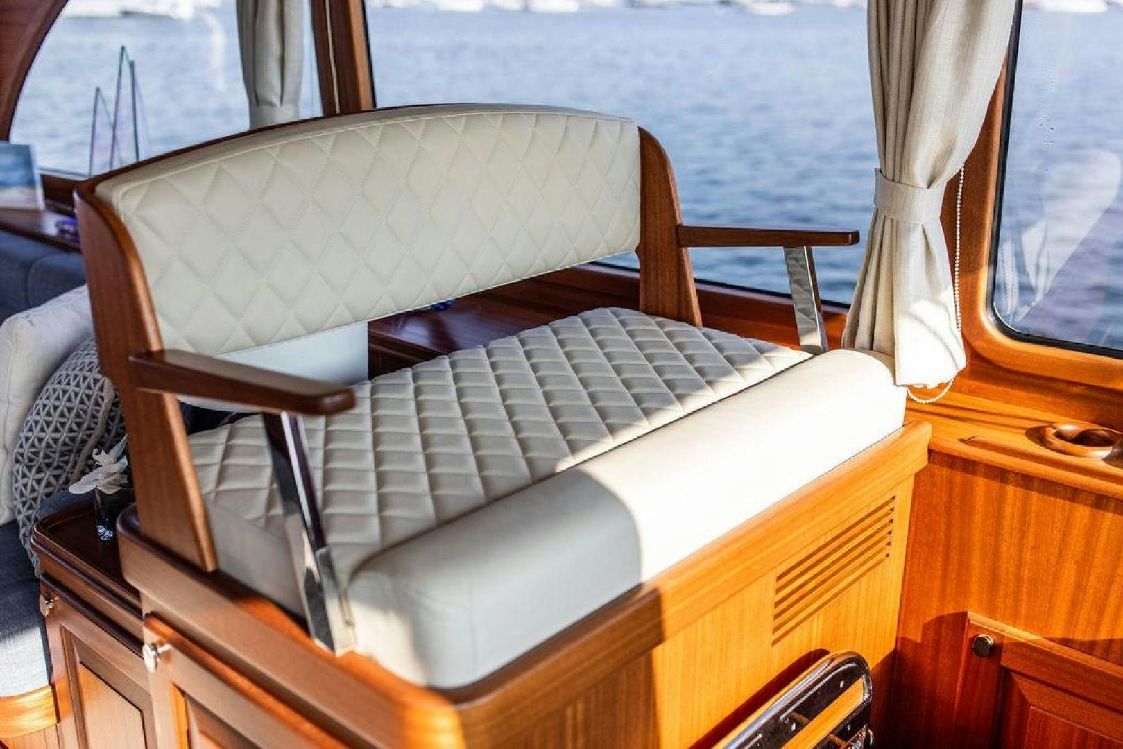 a brown leather couch aboard JESSICA Yacht for Sale