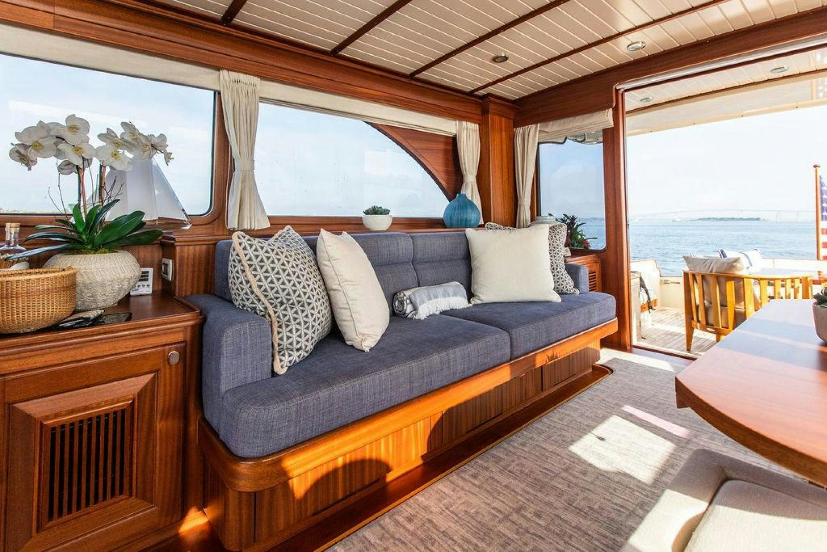 a living room with a large window aboard JESSICA Yacht for Sale