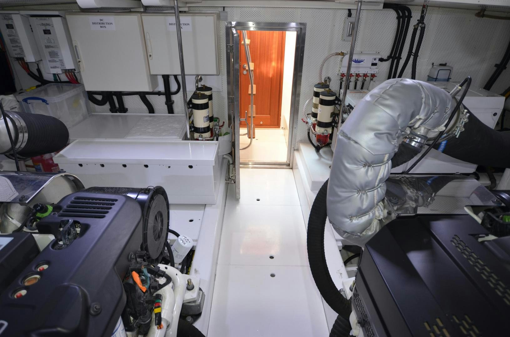 a person in a white lab coat working on a machine aboard JESSICA Yacht for Sale