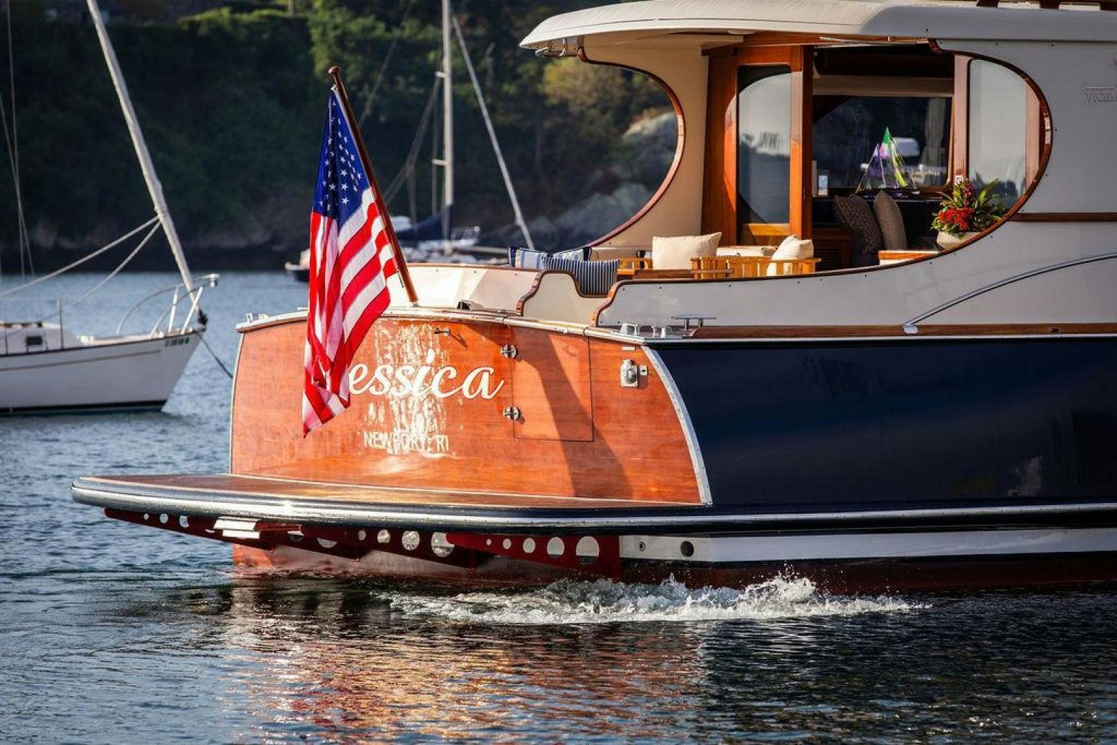 a boat with a flag on the front aboard JESSICA Yacht for Sale