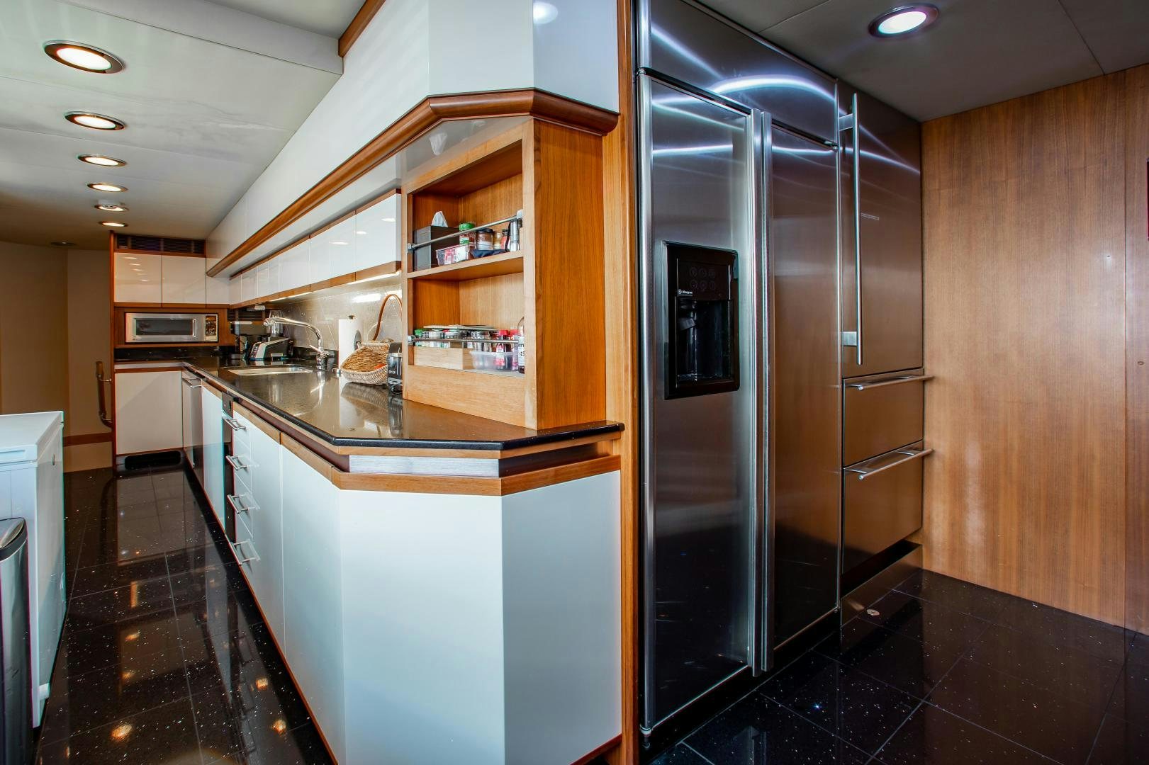 a kitchen with a large glass shower aboard BLACKSHEEP Yacht for Sale