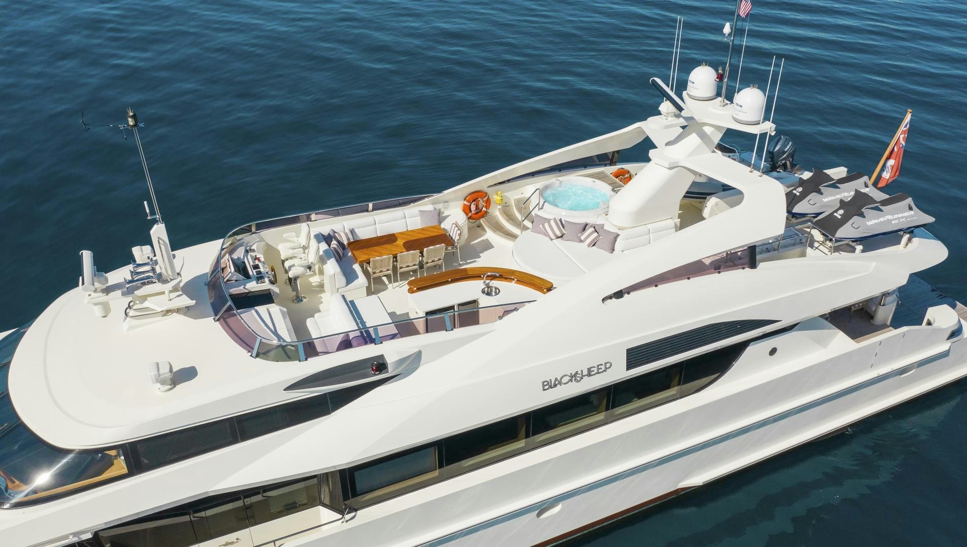 a white yacht on the water aboard BLACKSHEEP Yacht for Sale