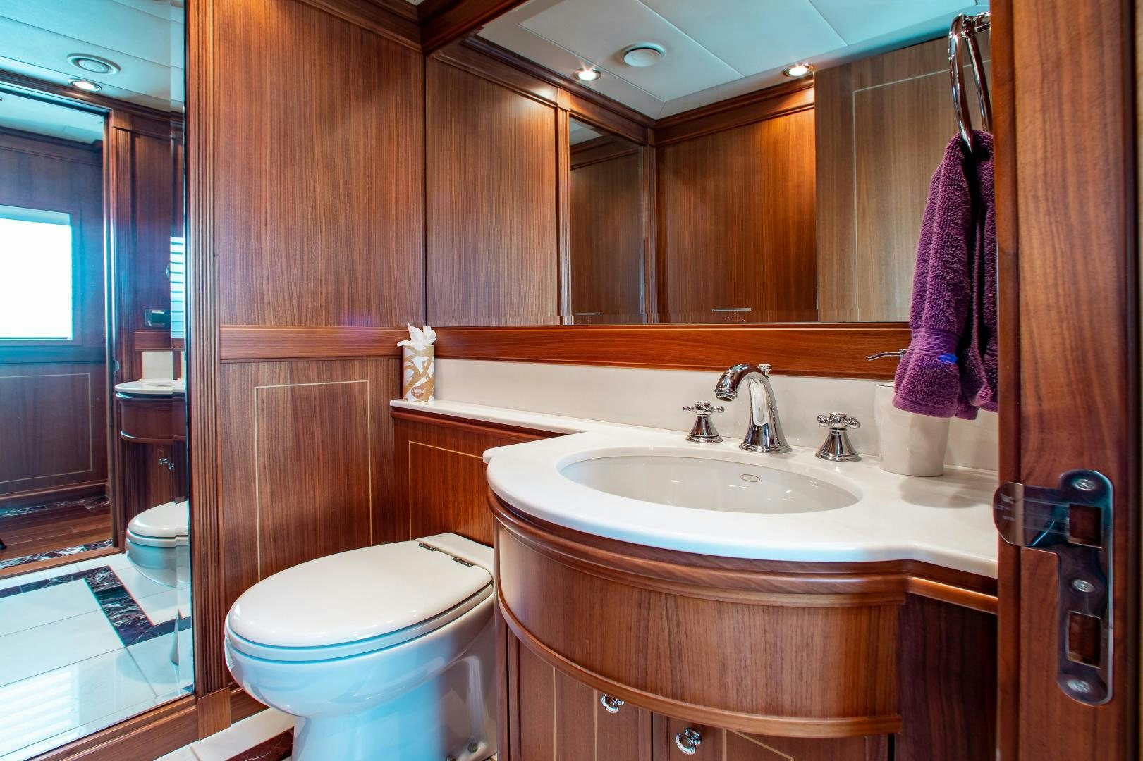 a bathroom with a sink and toilet aboard BLACKSHEEP Yacht for Sale