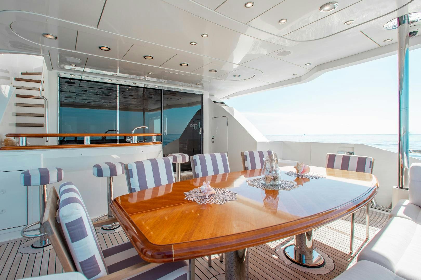 a dining room with a table and chairs aboard BLACKSHEEP Yacht for Sale
