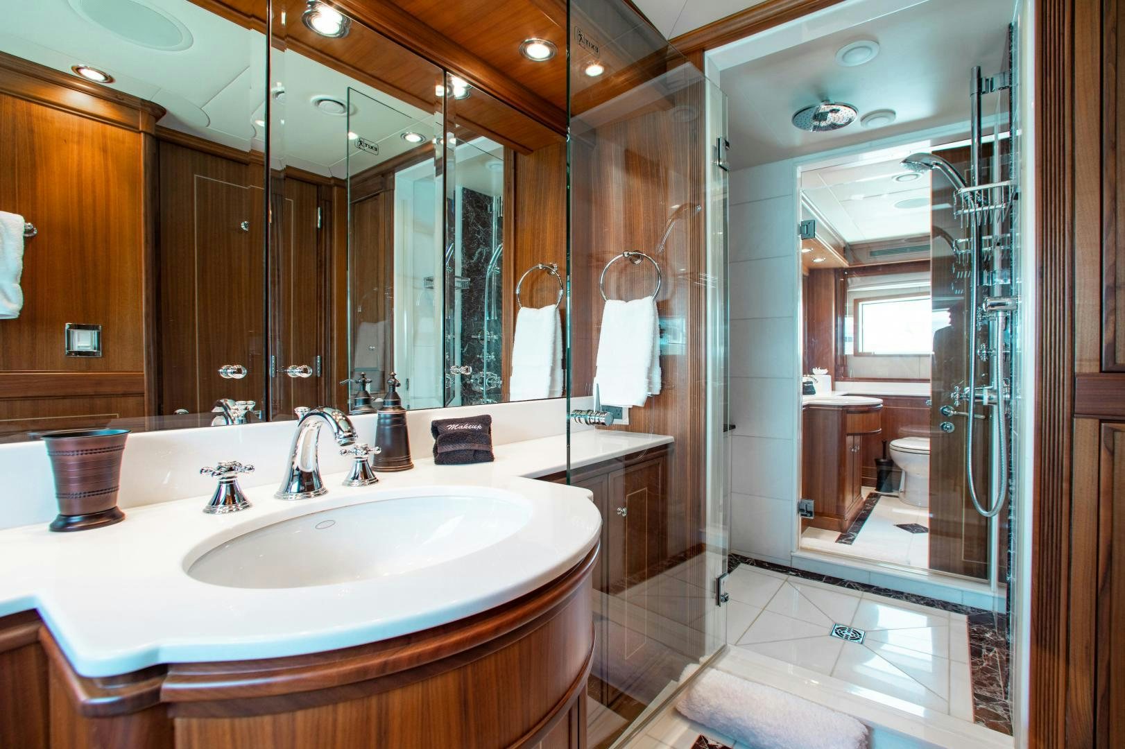 a bathroom with a large mirror aboard BLACKSHEEP Yacht for Sale