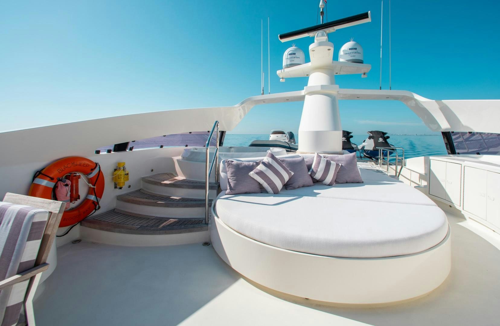 a white bed with a white pillow aboard BLACKSHEEP Yacht for Sale