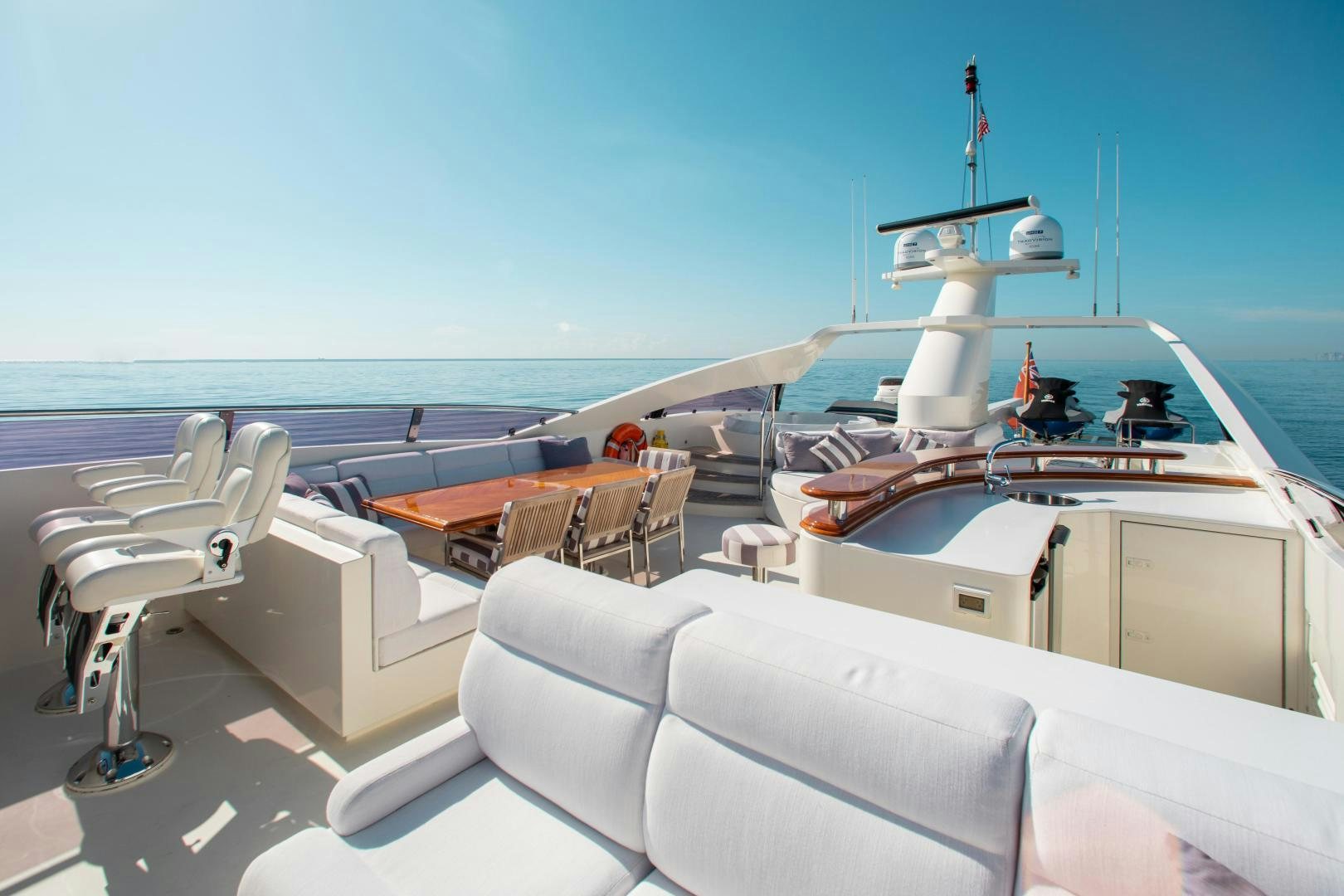 a boat with a desk and chairs aboard BLACKSHEEP Yacht for Sale