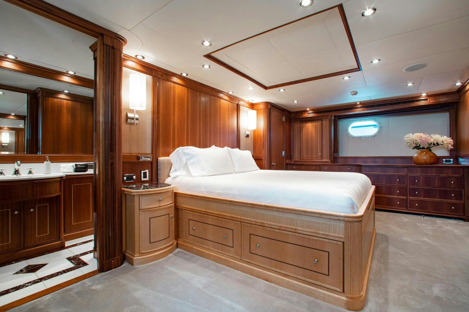 a large bedroom with a large bed aboard BLACKSHEEP Yacht for Sale