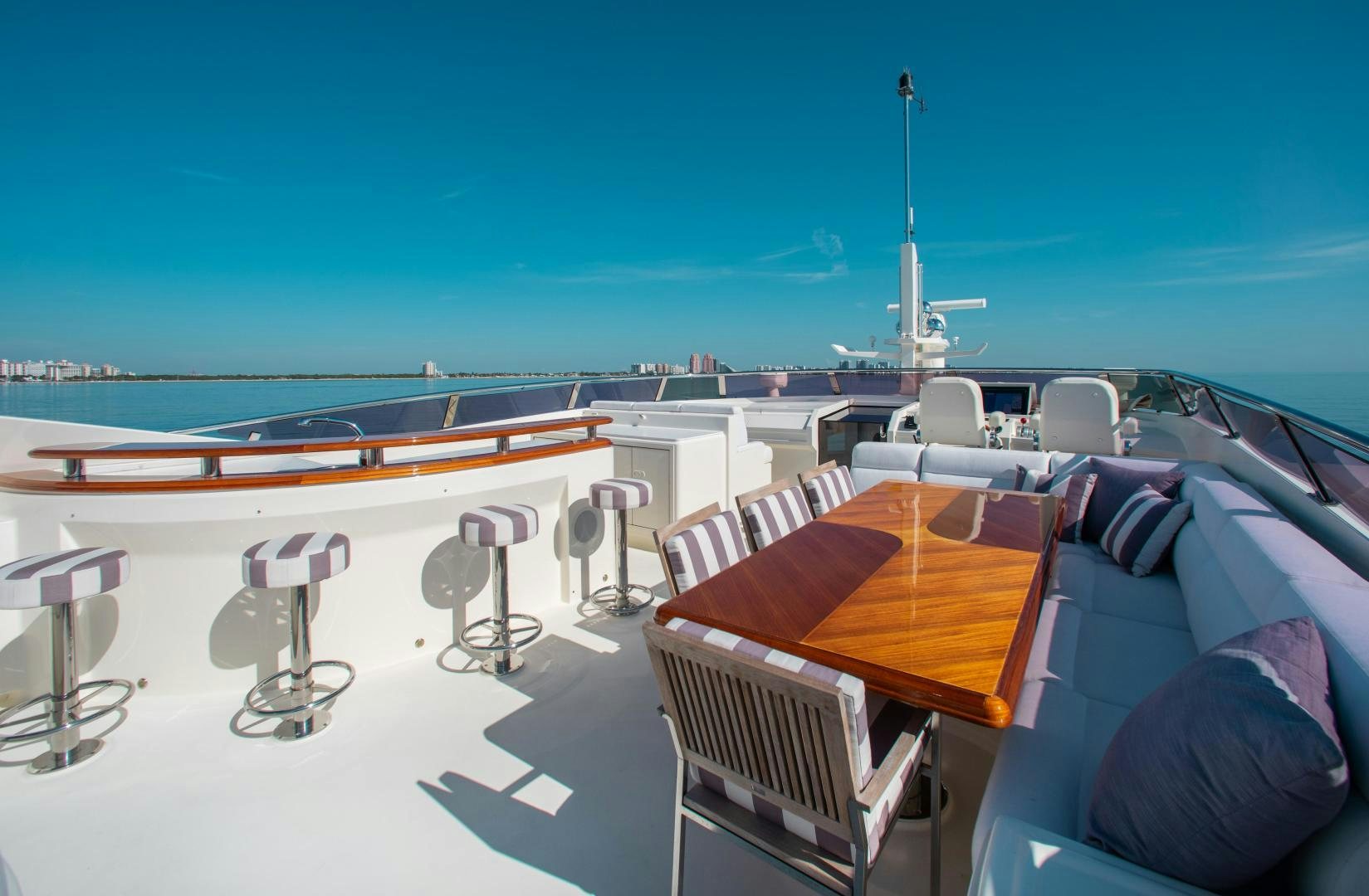 a room with a table and chairs aboard BLACKSHEEP Yacht for Sale