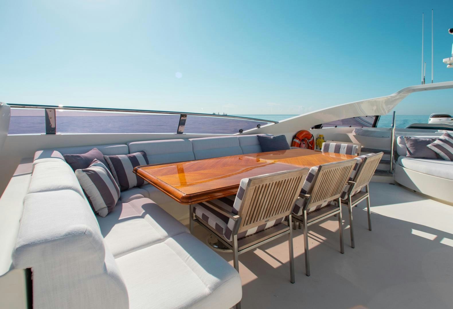 a room with a table and chairs aboard BLACKSHEEP Yacht for Sale
