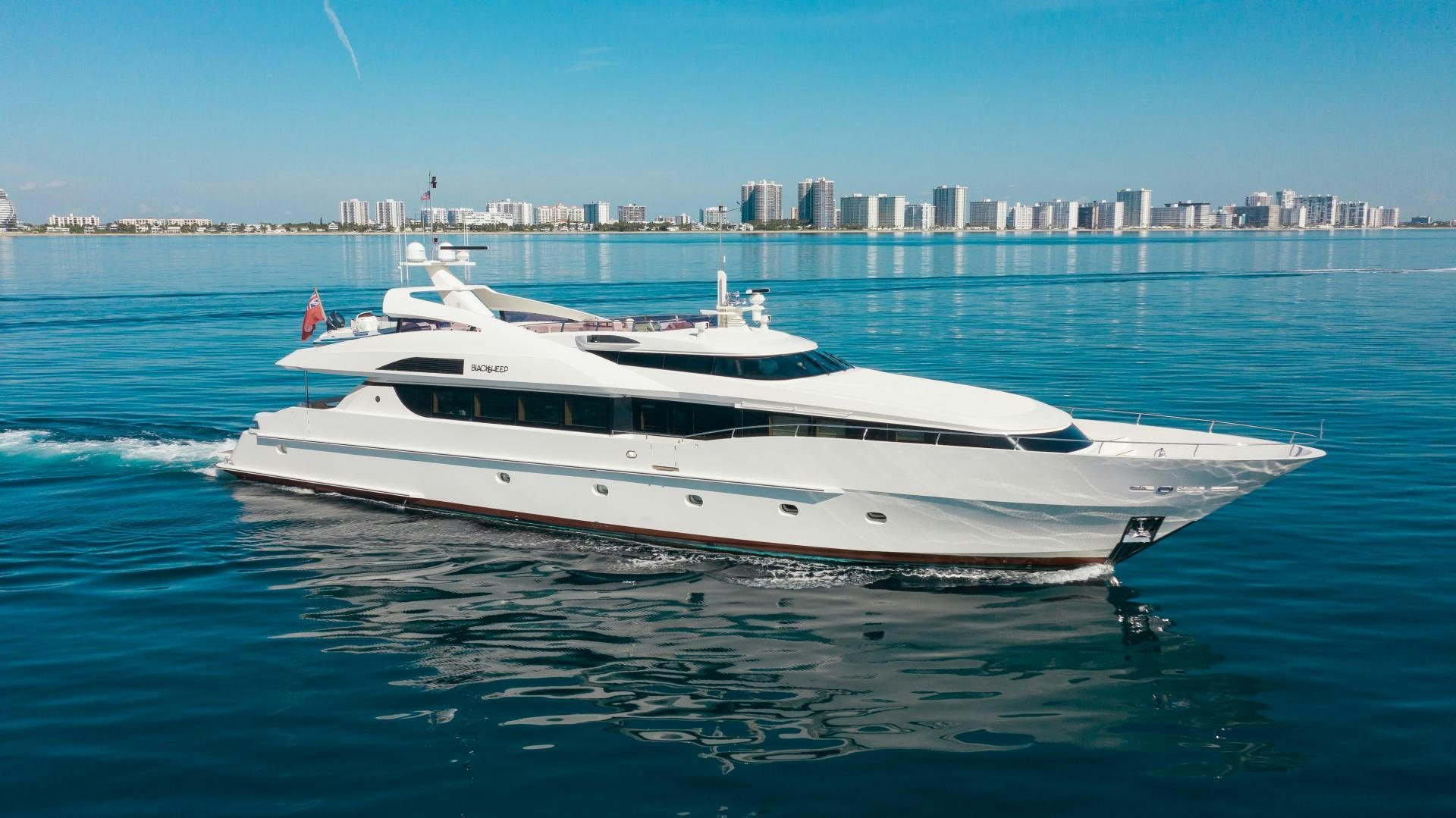 a white yacht on the water aboard BLACKSHEEP Yacht for Sale
